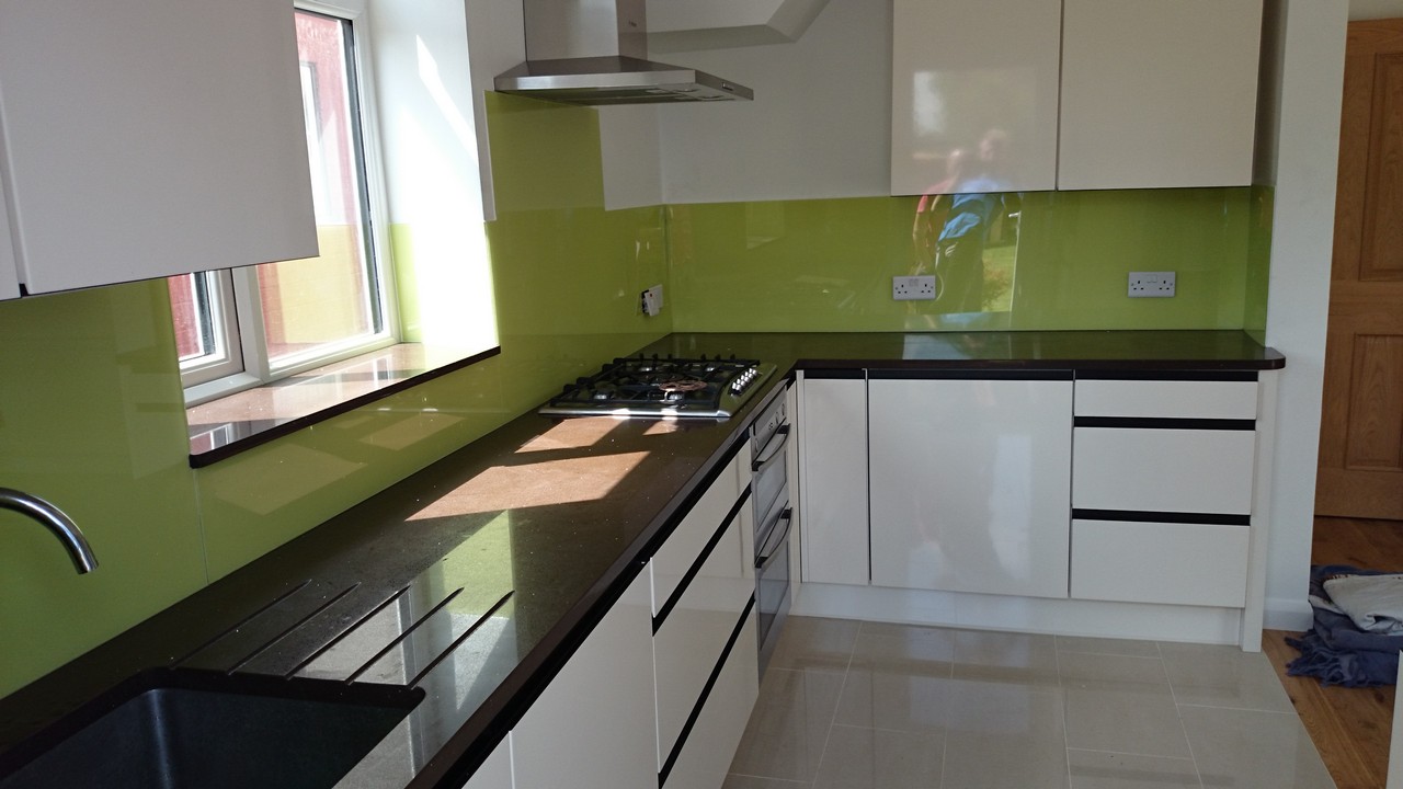 Lime green glass kitchen splashback installed by Brentford glaziers